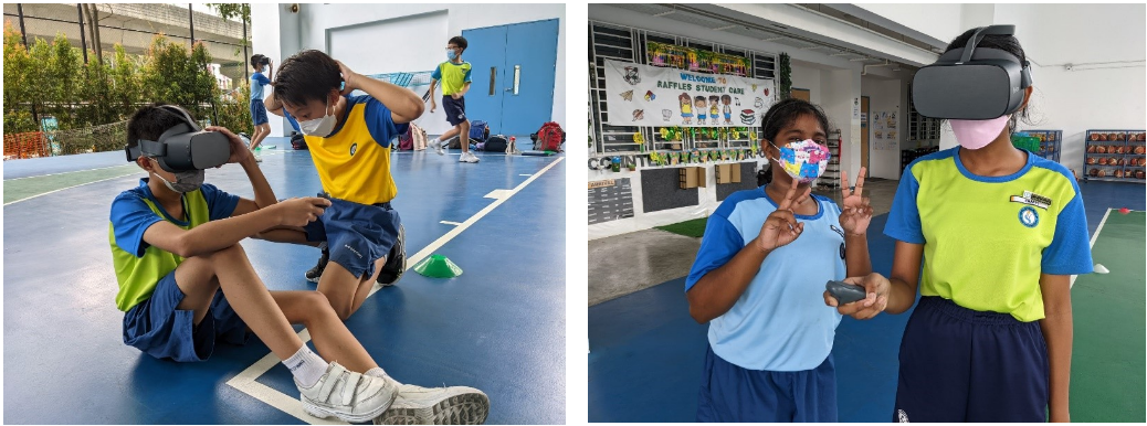 Students wearing VR headsets and face masks in a school gym, with two sitting on the floor and two standing.